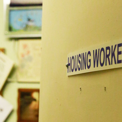 image of a door labeled housing worker