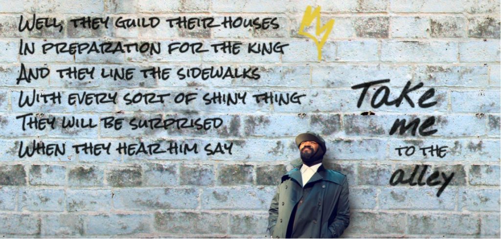 image of man leaning against a wall with lyrics around him