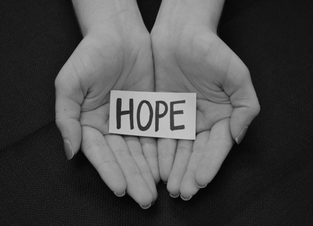 the word hope in a pair of hands