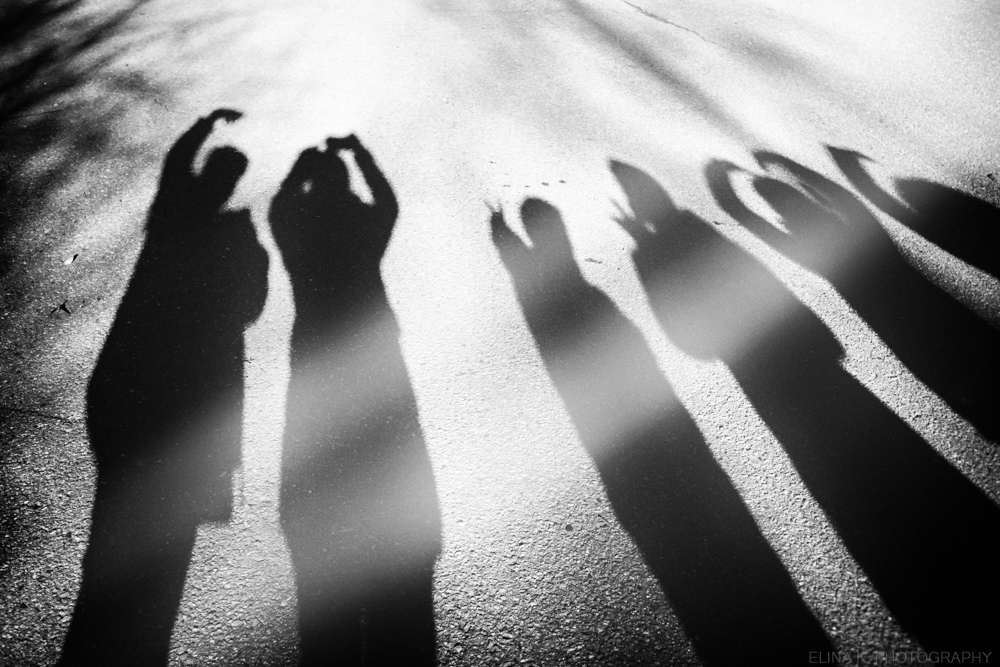 long shadows of a group of people
