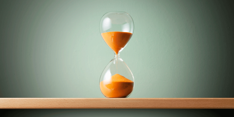 image of an hourglass with orange sand